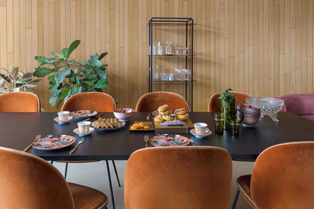 Warm orange tone dining chairs upholstered in fibreguard fabrics