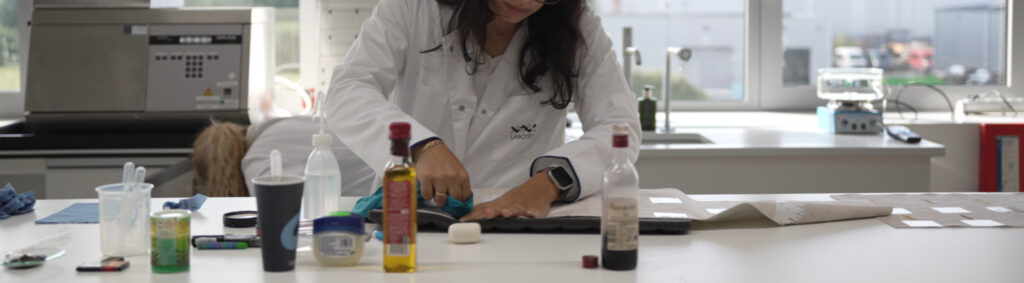 A textiles laboratory scientist tests fibreguard fabrics for stains in labotex 3