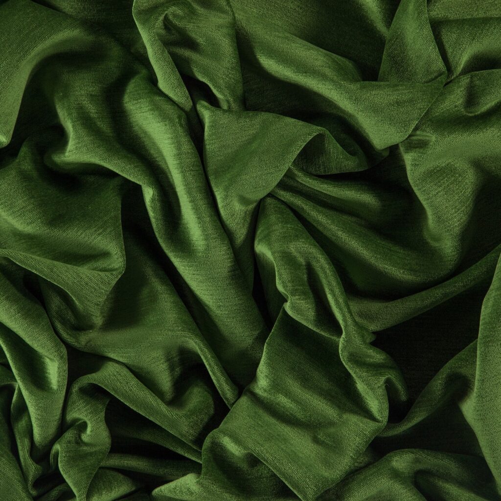 lush green velvet fabric in a decadent pile