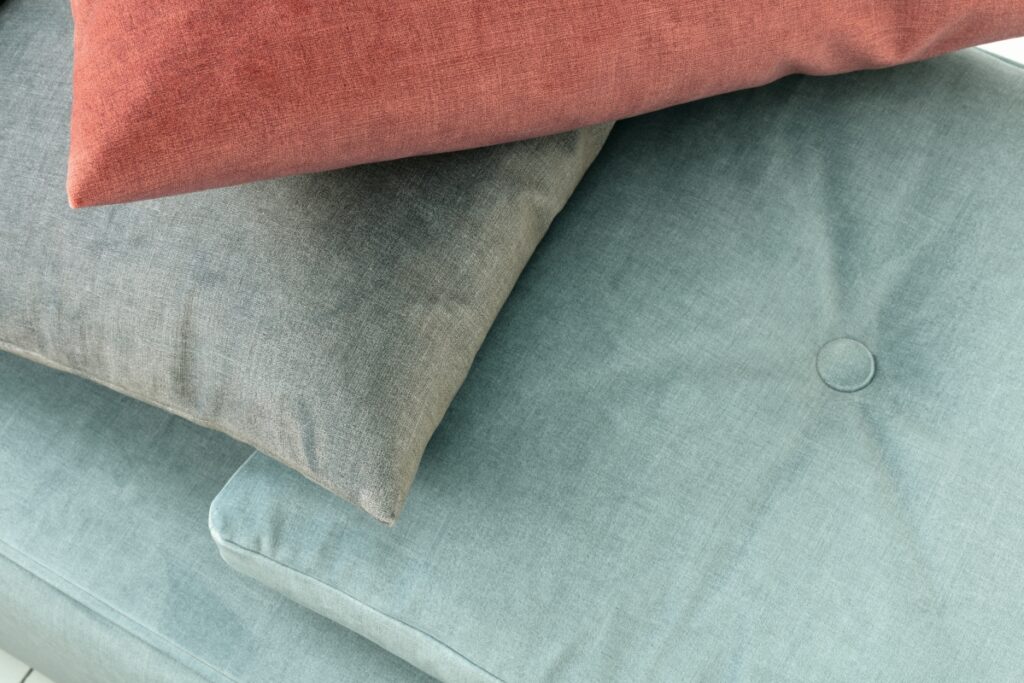 close up of pastel velvet cushions in fibreguard high performance fabric