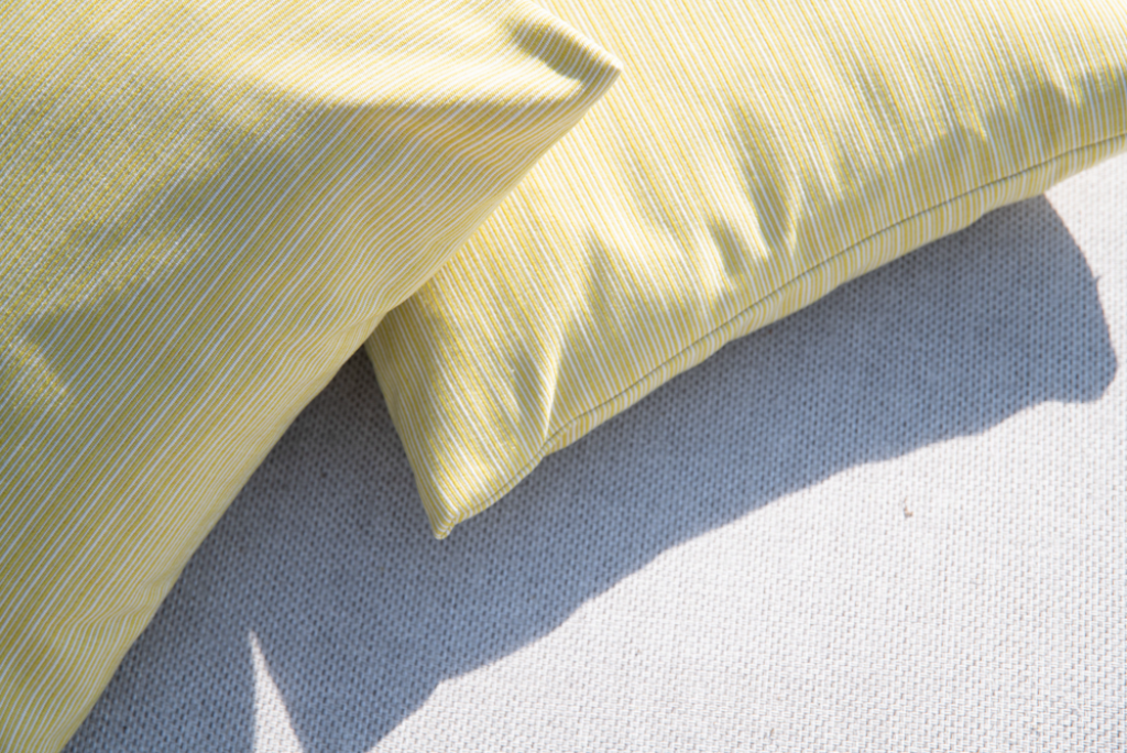 overhead shot of two yellow cushions