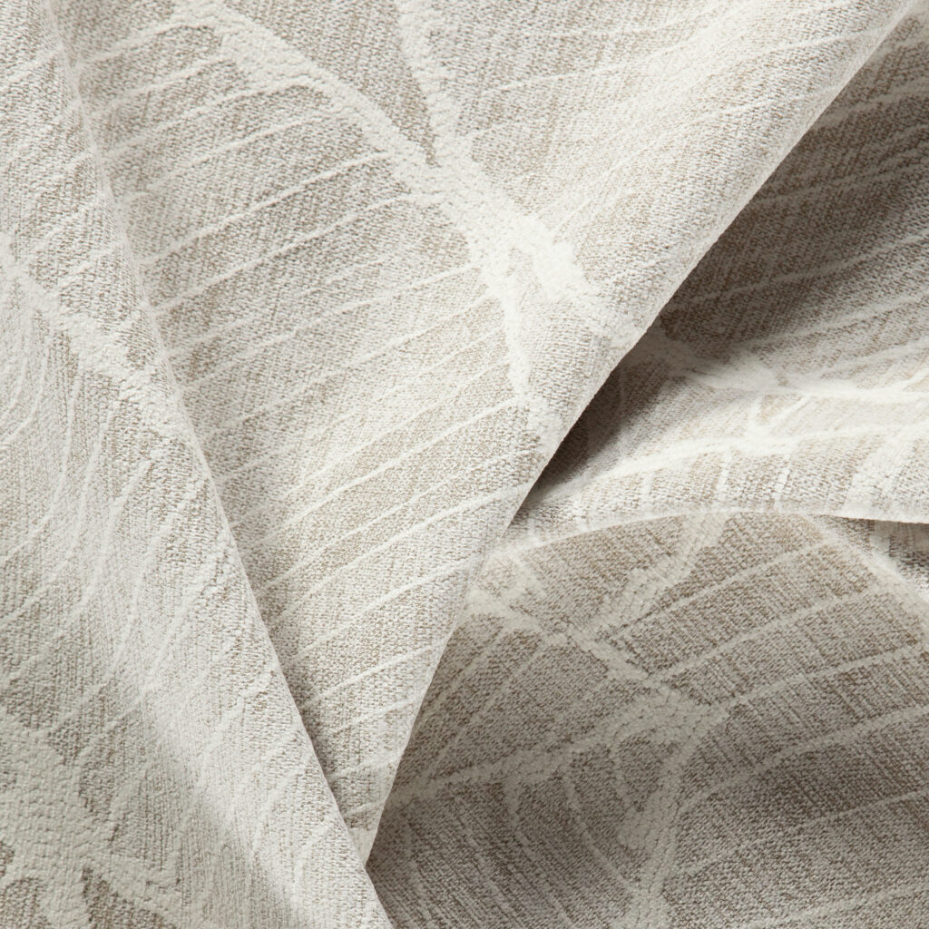 cream coloured organic pattern jacquard upholstery fabric close up