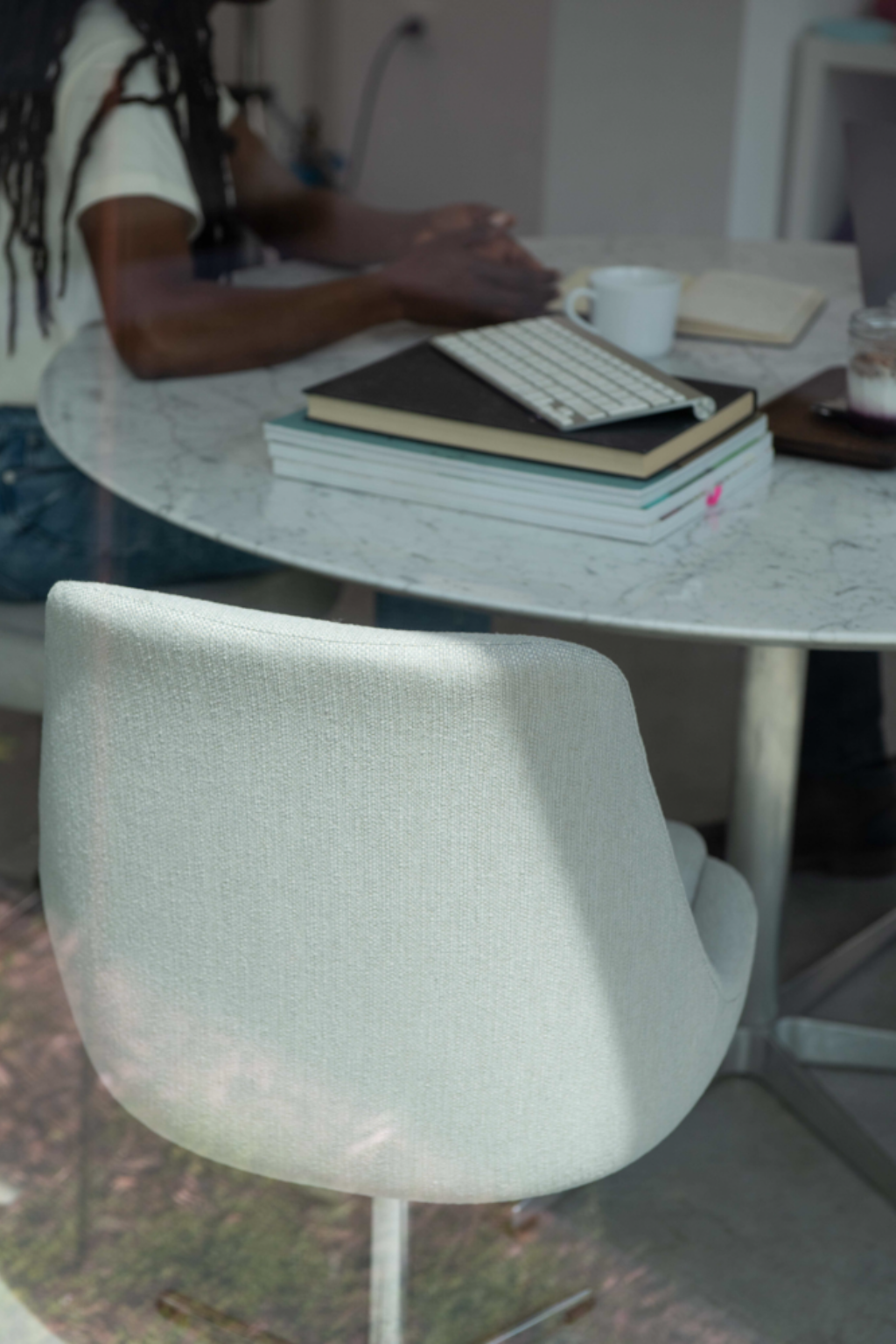 a curved chair at a curved table in an office