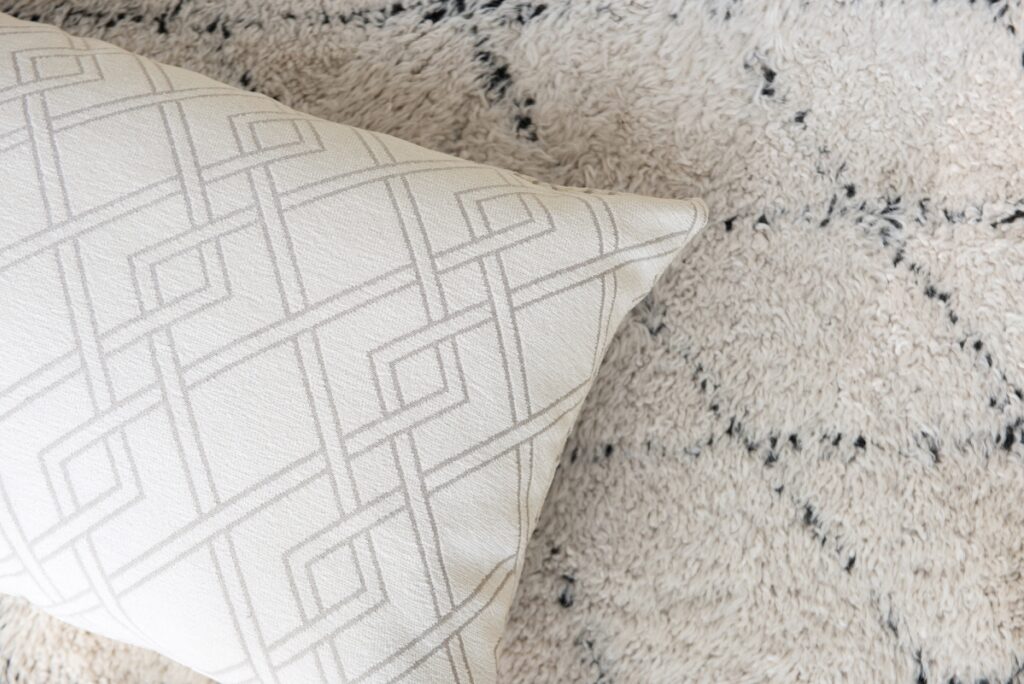 white jacquard fabric pillow