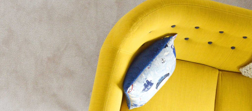 Bright yellow sofa upholstered in FibreGuard
