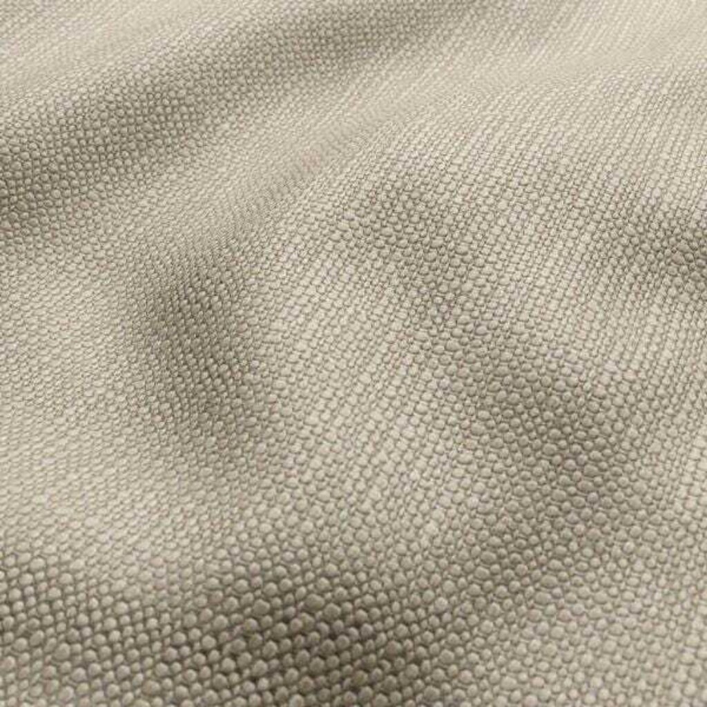 Close-up of a soft beige fabric, showcasing its texture and subtle color variations